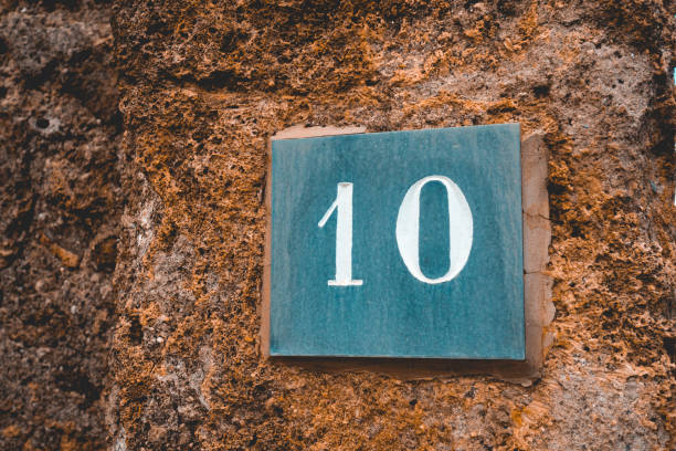 istock number 10 sign on grey marble stone 1154372245