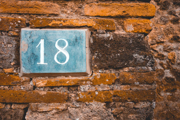 istock number 18 letters with copy space on the wall 1154373054