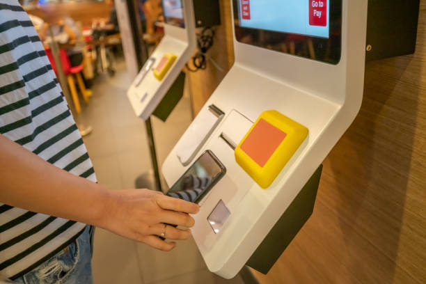 istock Asian woman using mobile payment shopping mall 1154373267
