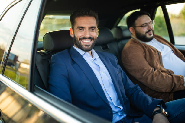 istock Two men on back seat of a car 1154373321