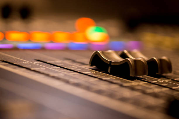 istock Closeup of Professional Digital Audio  Sound Mixing Control Console. Silver  White Faders and black Graphic control Console 1154373488
