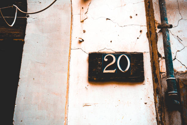 istock number 20 door sign on white building 1154373602