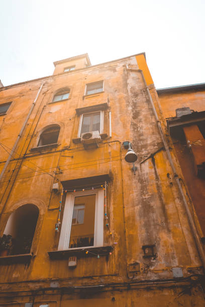 istock ancient orange apartment house at napoli from the low angle view 1154374579