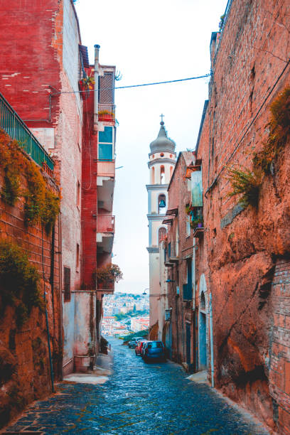 istock ancient street at napoli with church tower in the end 1154374792