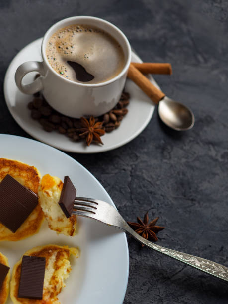 istock white Cup of espresso and cheese pancakes with bitter chocolate 1154375864