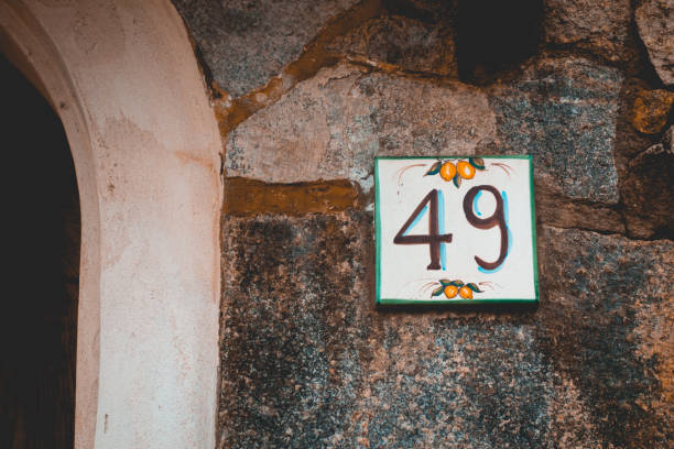 istock number 49 door sign on ancient house 1154376549