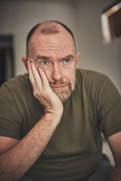 istock Stressed or depressed middle-aged man contemplates life 1154377133