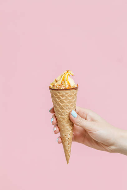 istock Ice Cream in a waffles cone on color background. 1154377752