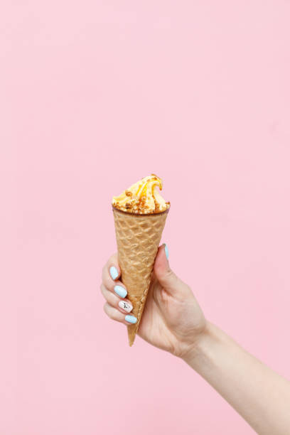 istock Ice Cream in a waffles cone on color background. 1154377817