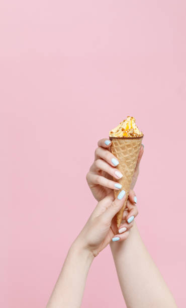 istock Ice Cream in a waffles cone on color background. 1154378412