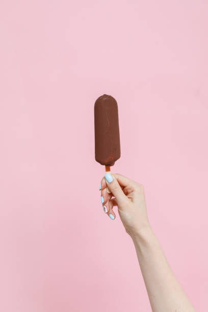 istock Ice Cream in a waffles cone on color background. 1154378418