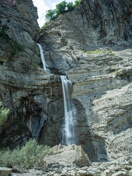 istock Two waterfalls in Broto, spanish Pyrenees in Huesca 1154378550