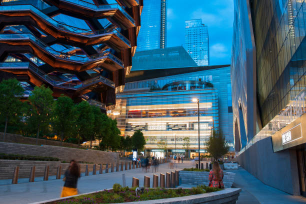 The modern new buildings at Hudson Yards with people walking or resting in Midtown Manhattan stock photo