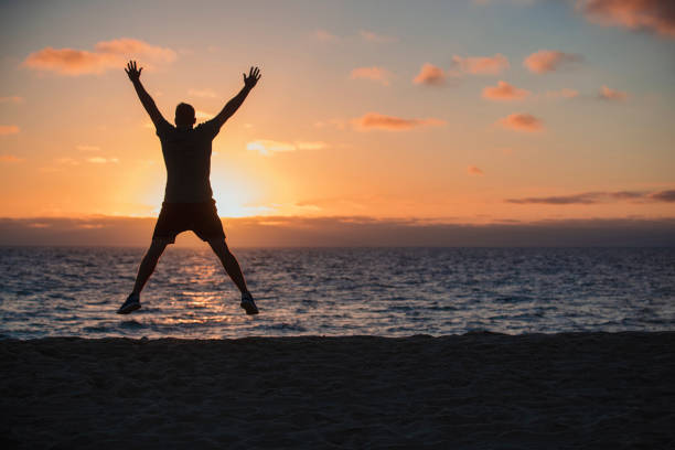 istock Star Jumps on the Beach 1154382817