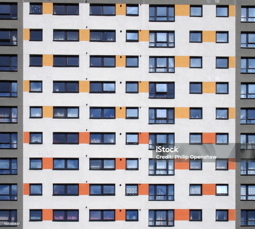 A Full Frame Image Of Windows In A Large High Rise Apartment Building ...
