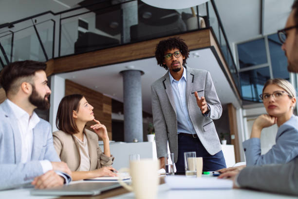 istock Young businessman giving presentation in the office 1154387036