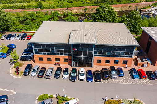 The main office of Sumo Digital - Video Game Developers of Hitman, Sonic, Dead Island, Crackdown, Little Big Planet and Snake Pass. Showing the iconic figure on the front of the glass building - Taken in early summer 2019