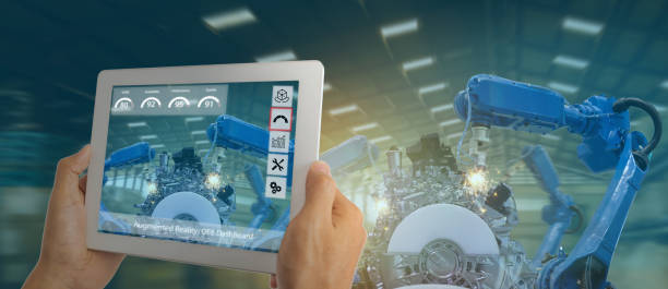istock iot industry 4.0 concept,industrial engineer using software (augmented, virtual reality) in tablet to monitoring machine in real time.Smart factory use Automation robot arm in automotive manufacturing 1154387335