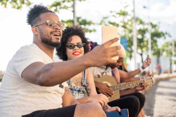 Technology and youth Multi-Ethnic Group, Springtime, Toothy Smile, Selfie, Millennial Generation acoustic guitar tattoos stock pictures, royalty-free photos & images