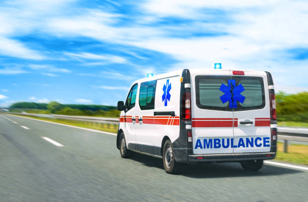 istock Ambulance van on highway with flashing lights 1154392709
