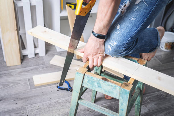 istock Joinery: furniture master restores the old dilapidated stool. 1154395630