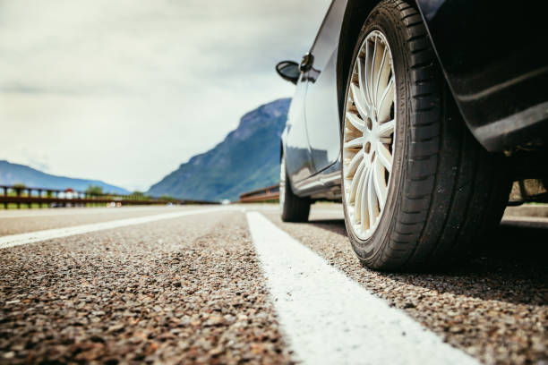 Broken down car, standing on breakdown lane. Close up of a car standing on a breakdown lane, summer vacation tire vehicle part photos stock pictures, royalty-free photos & images