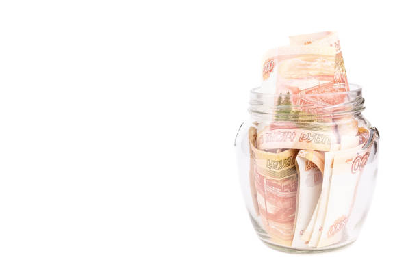 istock Glass jar with money 1154395899