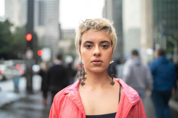 Photo of Portrait of a young latin woman in the city