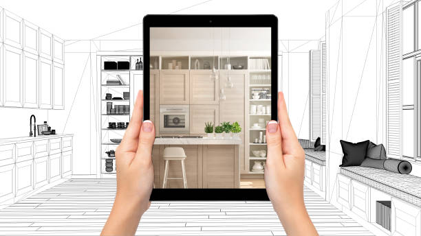 istock Hands holding tablet showing modern white and wooden kitchen. Blueprint CAD sketch background, augmented reality concept, application to simulate furniture and interior design products 1154397013