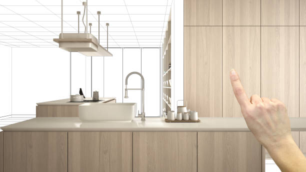 istock Unfinished project, under construction draft, concept interior design sketch, hand pointing real wooden kitchen with blueprint background, architect and designer idea 1154397144