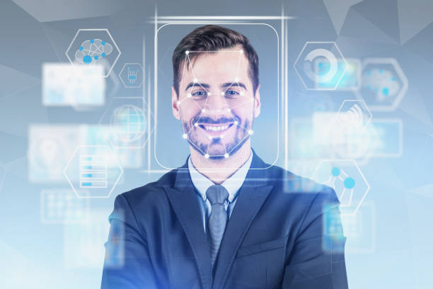 istock Smiling man in suit facial recognition technology 1154398320