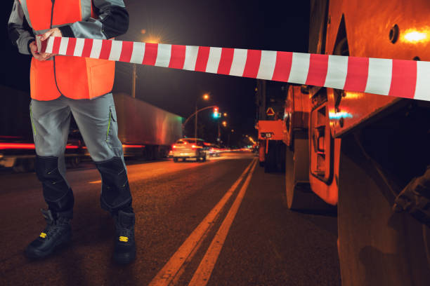 istock Worker blocks repair street 1154400436