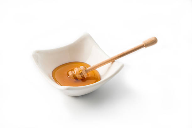 istock Flavouring: Honey Dipper in a bowl 1154400666