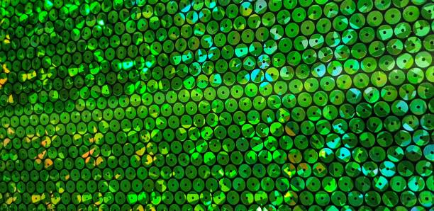 istock Fabric coupon glitter sewn bright green. 1154404212