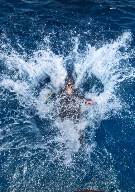 Scuba Diver jump in ocean