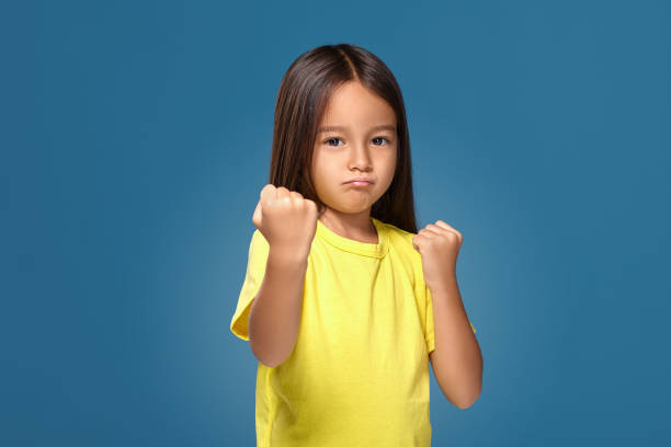 istock Angry little kid showing frustration and disagreement 1154405486