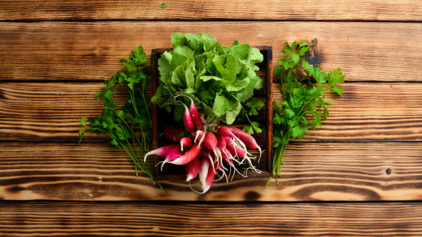 istock Fresh radish on a wooden table. Fresh vegetables. Top view. Free space for text. 1154406809
