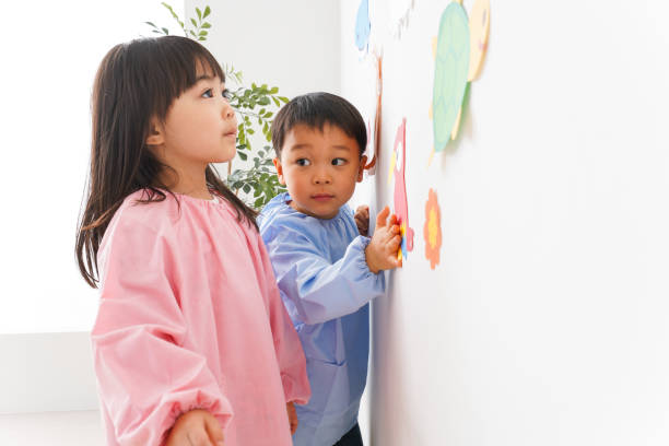 istock Girl and boy playing at home 1154409167