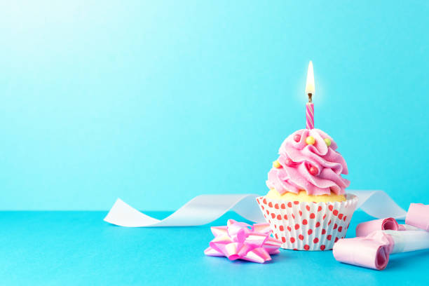istock Colorful celebration background with various party decoration and cupcake. Minimal party concept. 1154414901
