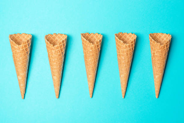 istock Various ice cream cones on blue background. Minimal summer concept. 1154414957