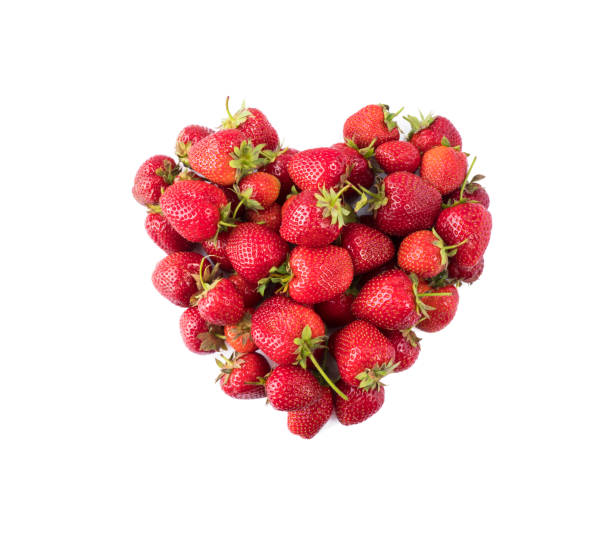 istock Heart shape strawberries on white background. Strawberries isolated on white background. Ripe berries close-up. Top view. Background of red berries. Background of fresh strawberries. Various fresh summer berries. 1154415110
