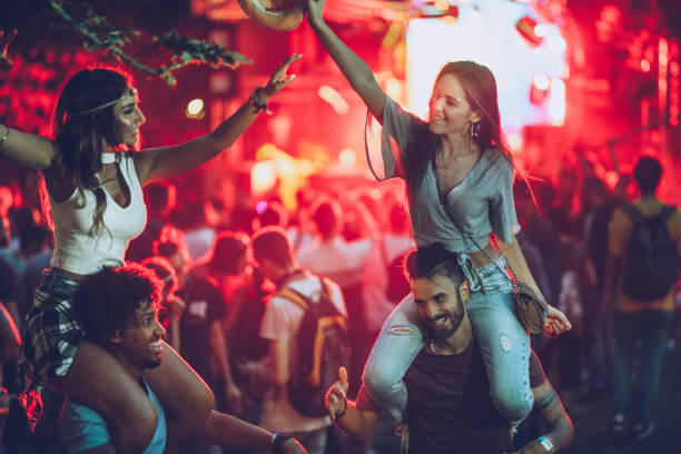 istock Happy couples having fun during music concert. 1154415766