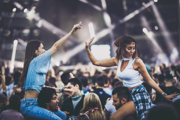 istock Happy couples having fun on a music festival. 1154415862
