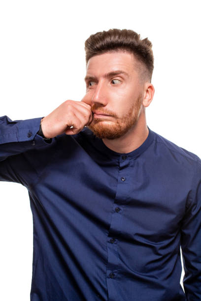 istock Attractive young man wearing blue shirt, isolated over a white background. 1154416000