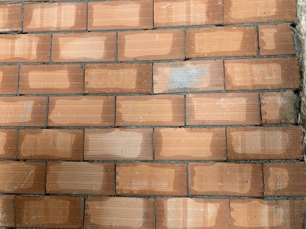 istock Red brick texture. Large red brick wall, european brickwork with natural defects, scratches, cracks, crevices, chips, dust, roughness 1154418509