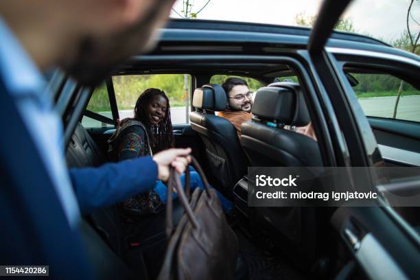 Man Entering Ride Sharing Car Stock Photo - Download Image Now - Car Pooling, Crowdsourced Taxi, Car
