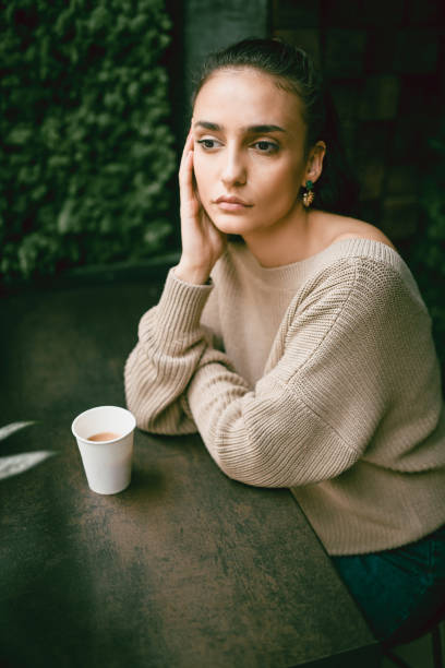 istock Modern Female Daydreaming Over Coffee 1154423124