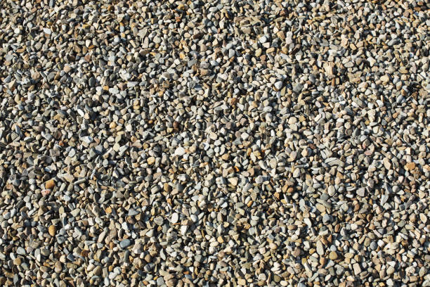istock Texture: small sanded gravel. Small white chalk stones. Artistic reliefs from natural objects. Material for construction work and the manufacture of concrete structures. Polished rock. Geological 1154425084