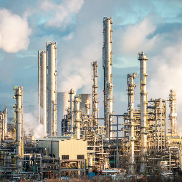 istock Distillation towers at an oil refinery 1154425149
