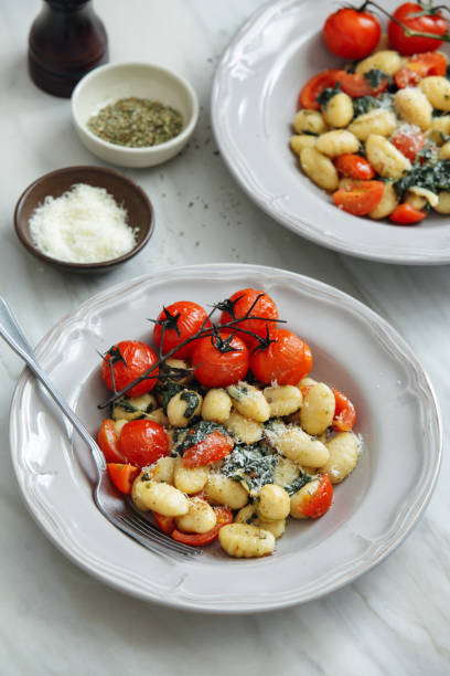 istock Gnocchi with creamy tomato and spinach sauce 1154425367